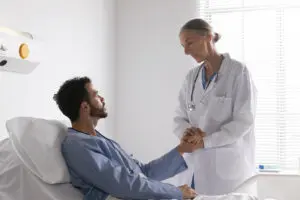 ill male patient bed talking nurse Digital Ware
